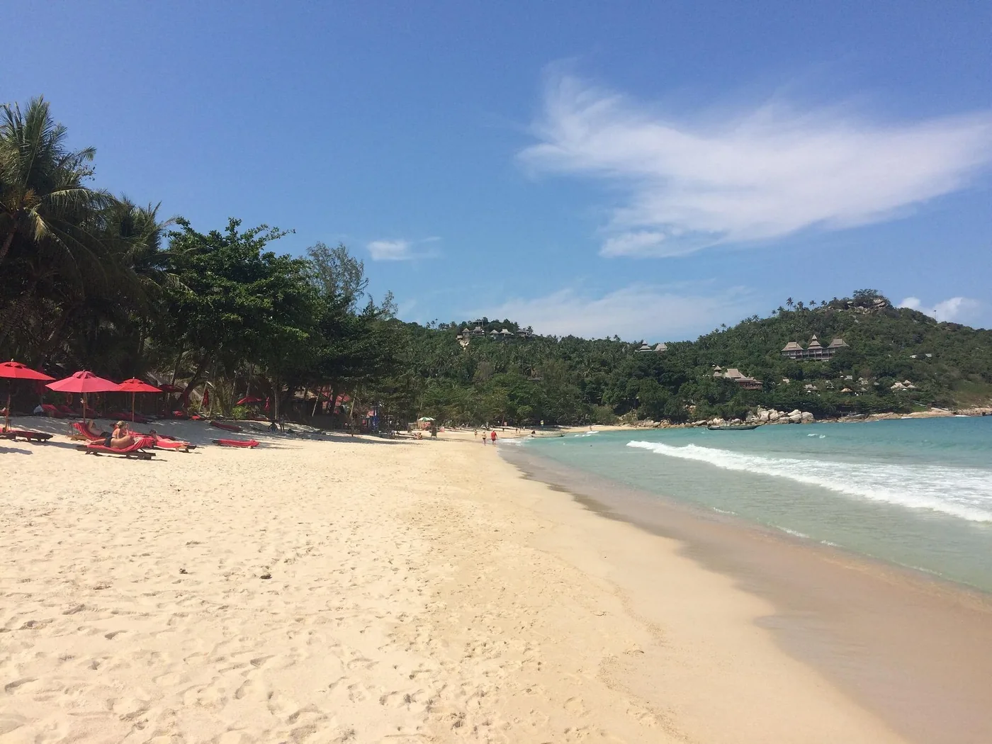 Thong Nai Pan Noi — wide white sand beach, red umbrellas and calm sea