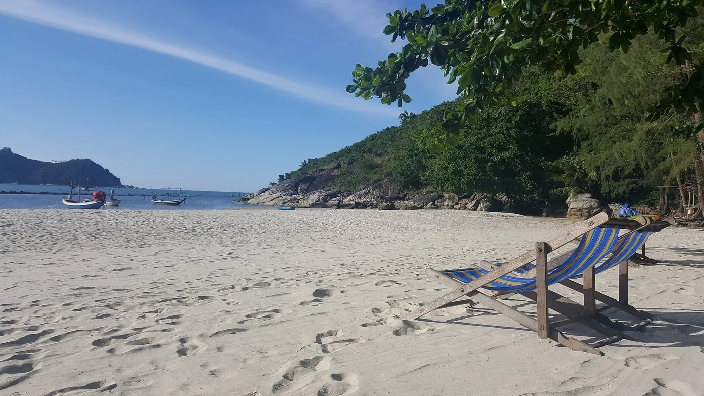 Thong Nai Pan beach — deserted white sand with a deckchair, morning light