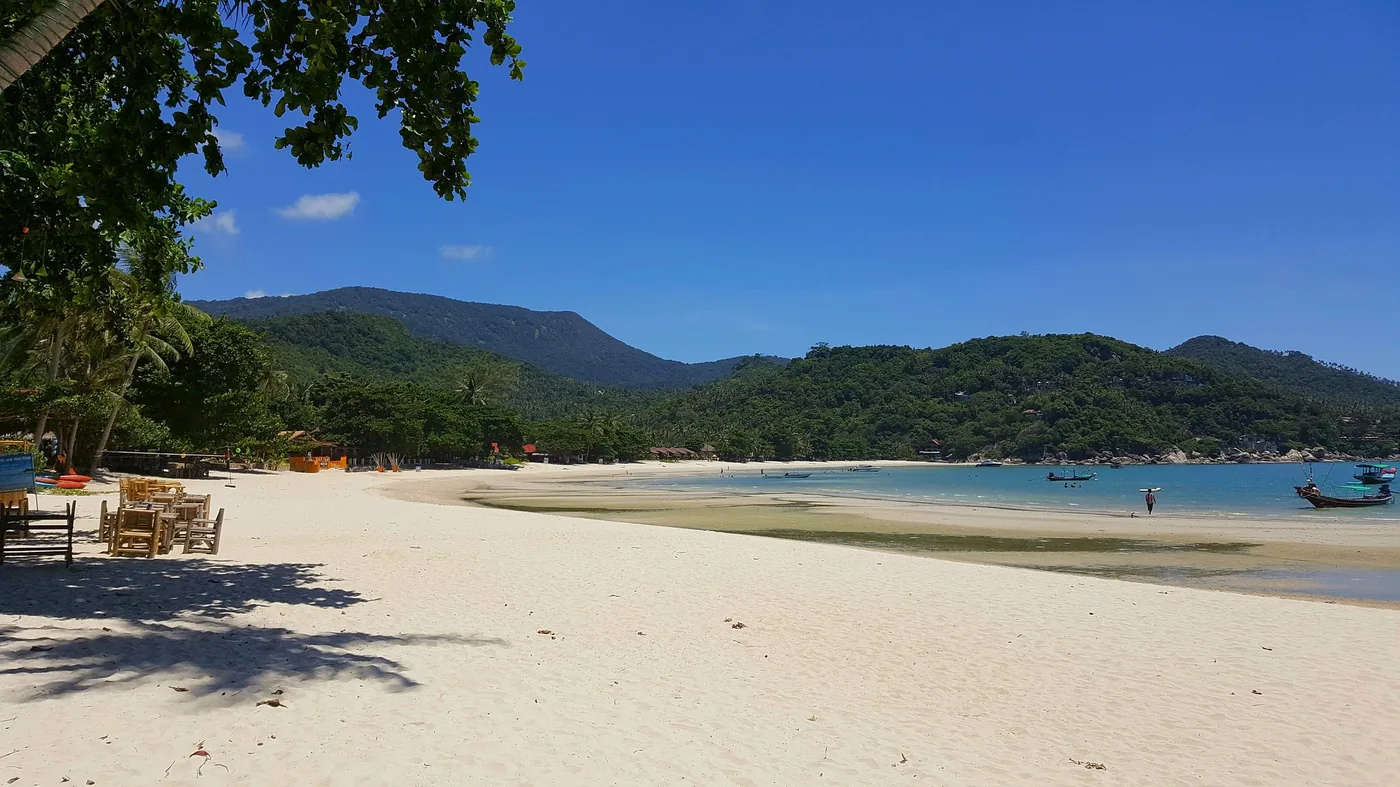 Thong Nai Pan Noi — beachside restaurant tables at sunrise
